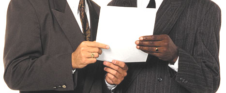 hands holding business memo
