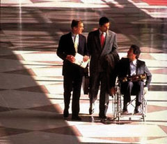 man in wheelchair in lobby