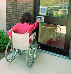 woman in wheelchair at door